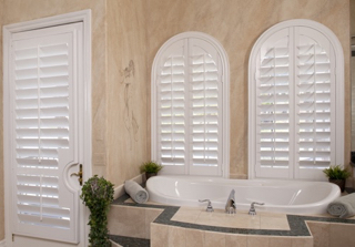 Arched plantation shutters bathroom